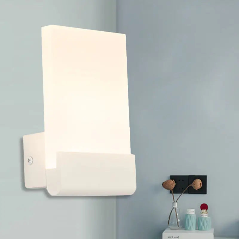 Cuboid LED wall sconce with white cast-iron frame and rectangular backplate on Tampa Home & Garden Store