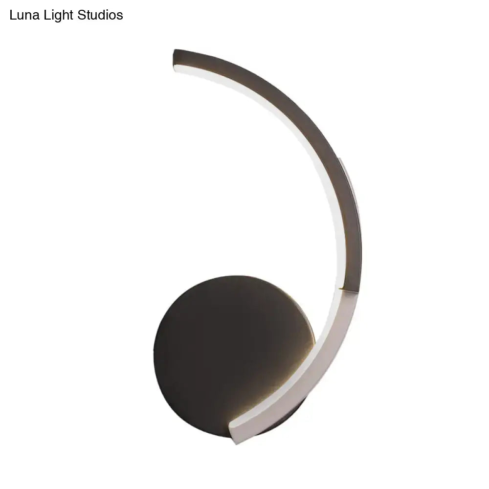 Curved LED Wall Sconce Decorbites with bronze circular base and illuminated arc on Tampa Home & Garden Store