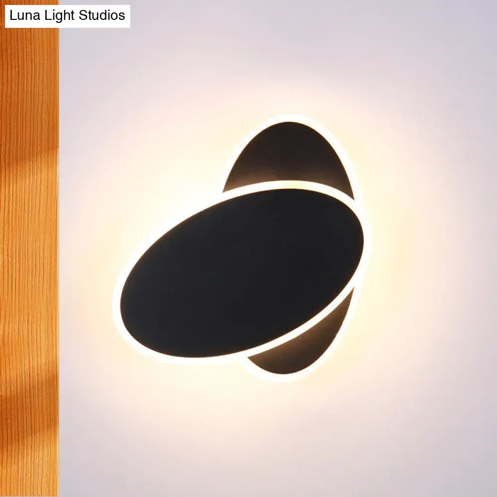 Black oval wall sconce by Decorbites, wall-mounted with halo LED glow on Tampa Home & Garden Store