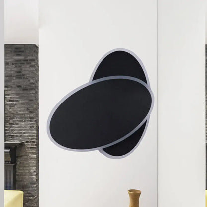 Black Oval Wall Sconce by Decorbites, matte black with light-gray trim, double-oval design on Tampa Home & Garden Store