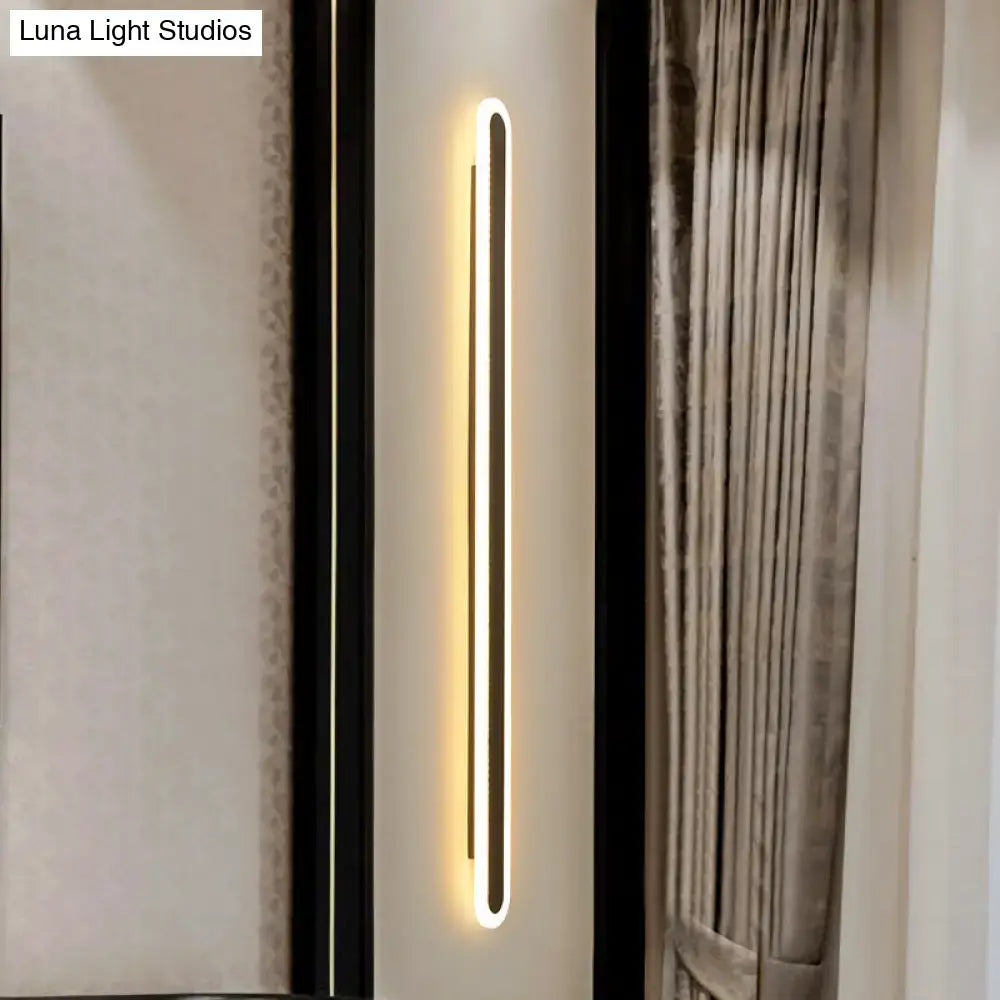 Modern black & white elliptical acrylic wall sconce by Decorbites, vertical LED aisle light on Tampa Home & Garden Store
