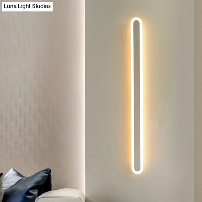 Modern black and white elliptical acrylic wall sconce with vertical LED glow wall light on Tampa Home & Garden Store