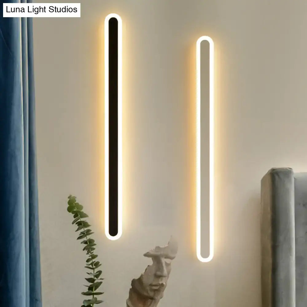 Modern black and white elliptical acrylic wall sconces pair with LED lighting by Decorbites on Tampa Home & Garden Store