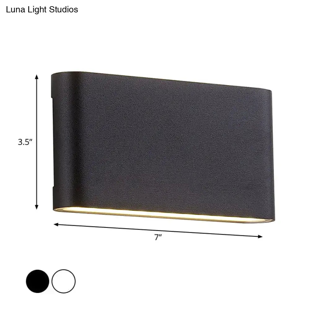 Black oblong wall lamp, Decorbites sconce with gold trim, 7in wide by 3.5in tall on Tampa Home & Garden Store