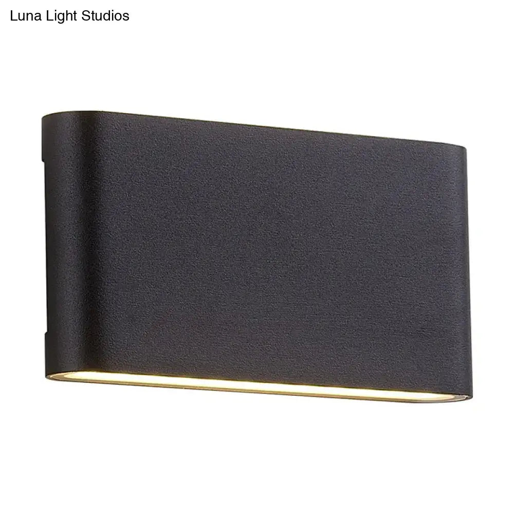 Black Oblong Wall Lamp by Decorbites with warm bottom glow on Tampa Home & Garden Store