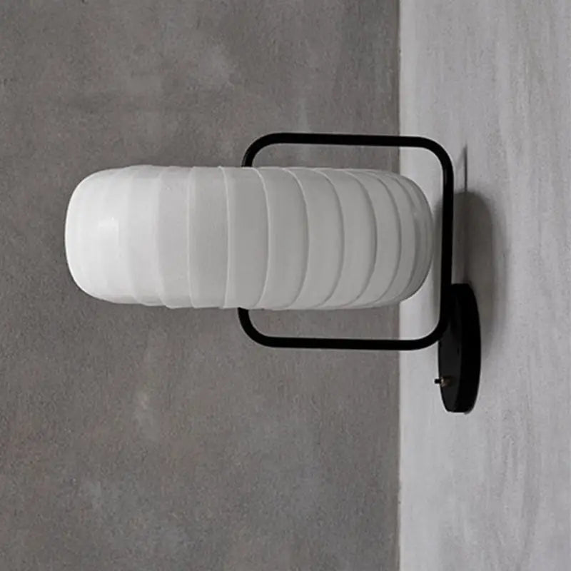 Black Pumpkin Wall Sconce with white ribbed glass shade and black metal frame on wall mount on Tampa Home & Garden Store