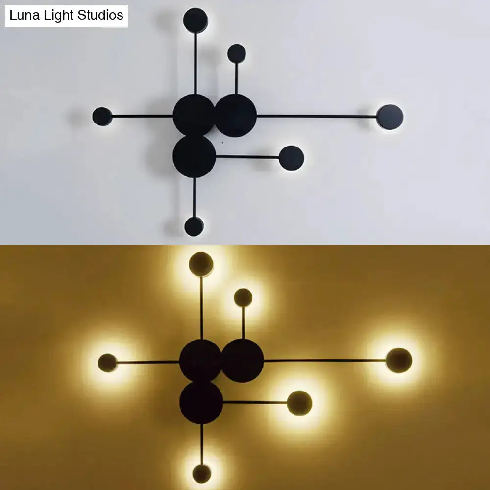 Modern black and white geometric wall sconce with circular discs Decorbites on Tampa Home & Garden Store