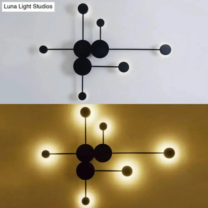 Modern black and white geometric wall sconce with circular discs Decorbites on Tampa Home & Garden Store
