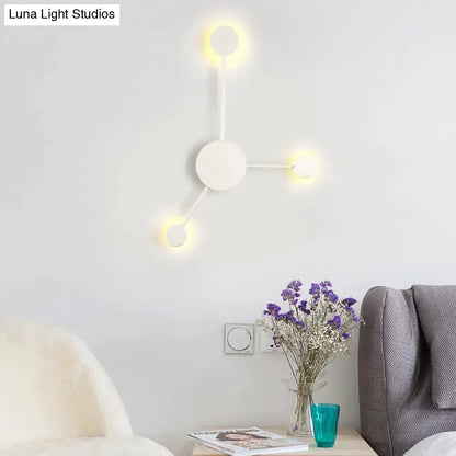 Modern white geometric wall sconce with circular nodes and warm LED lighting for living room on Tampa Home & Garden Store