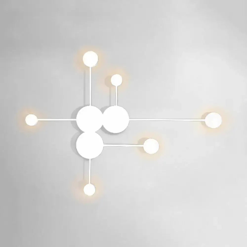 White geometric wall sconce with circular disk clusters by Decorbites for living room lighting on Tampa Home & Garden Store