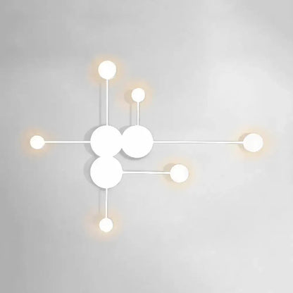 White geometric wall sconce with circular disk clusters by Decorbites for living room lighting on Tampa Home & Garden Store