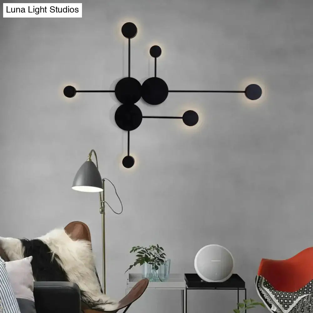 Wall sconce by Decorbites black & white geometric discs with soft halo light on Tampa Home & Garden Store