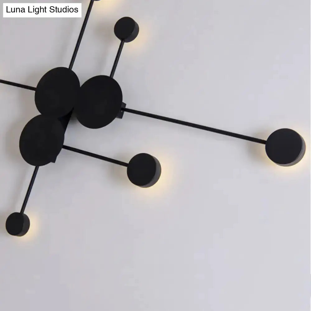 Decorbites modern black wall sconce with geometric cluster of circular disks and warm LED tips on Tampa Home & Garden Store