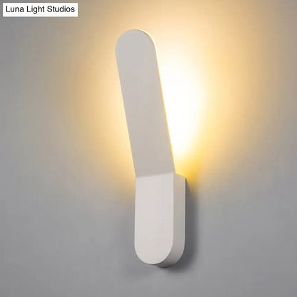 Black oval metal corridor wall sconce with warm glow Luna Light Studios Decorbites on Tampa Home & Garden Store