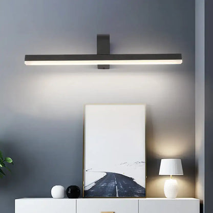 Black metal bathroom sconce with a horizontal LED bar, wall-mounted by Decorbites on Tampa Home & Garden Store