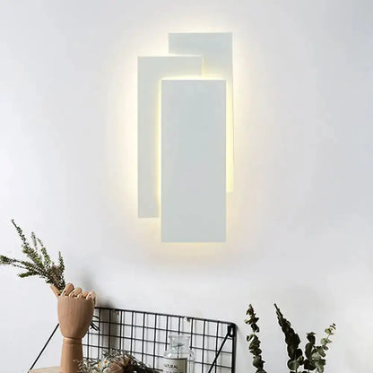 Modern white LED wall lamp with rectangular panels, warm backlit glow, 5in height for bedroom on Tampa Home & Garden Store