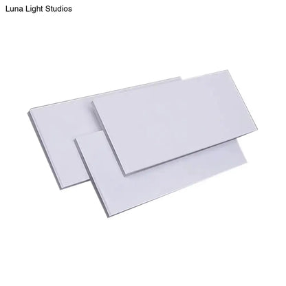 Modern white LED wall lamp with overlapping rectangular panels Decorbites on Tampa Home & Garden Store
