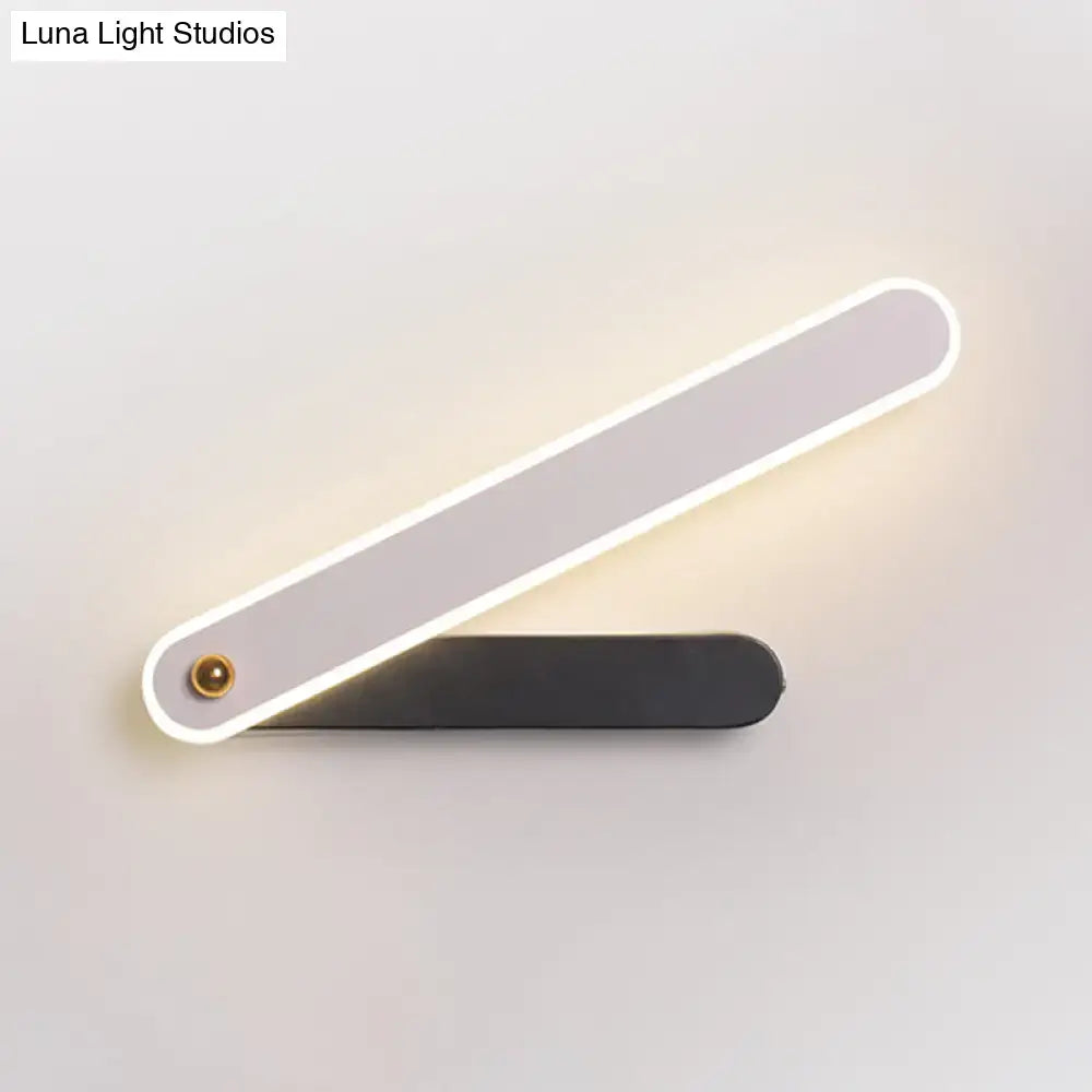 Black metal LED wall sconce by Decorbites, two-bar design with LED-lit white edge on Tampa Home & Garden Store