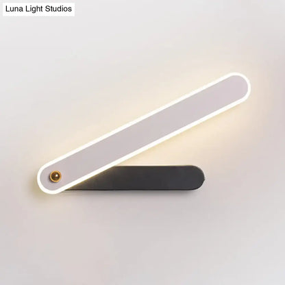 Black metal LED wall sconce by Decorbites, two-bar design with LED-lit white edge on Tampa Home & Garden Store