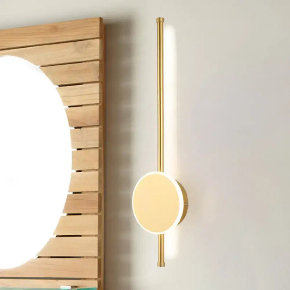 Decorbites white LED natural tone wall sconce with brass vertical bar and round disc on Tampa Home & Garden Store