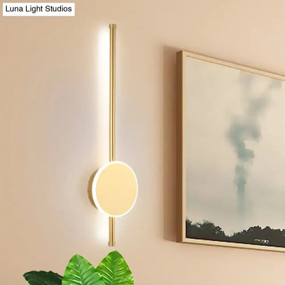 Decorbites white LED wall sconce with brass vertical mount and circular disk light on Tampa Home & Garden Store