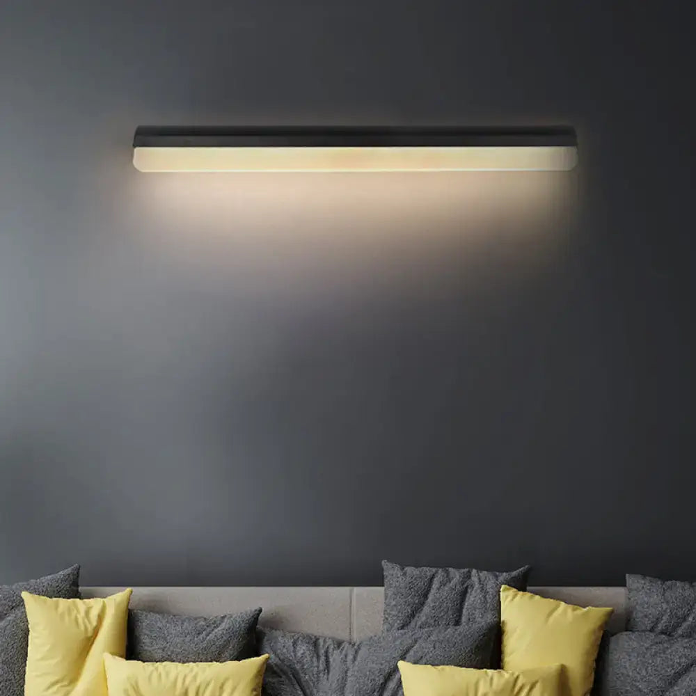 Modern black and white linear LED wall light sconce by Decorbites on dark wall on Tampa Home & Garden Store