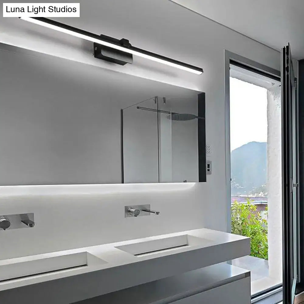 Black Iron Vanity Light by Decorbites mounted above white bathroom vanity with large mirror on Tampa Home & Garden Store