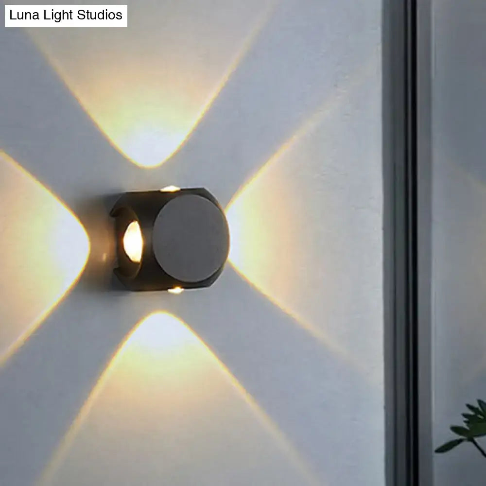 Mini Cube Wall Sconce by Decorbites in matte black metal with warm light on Tampa Home & Garden Store