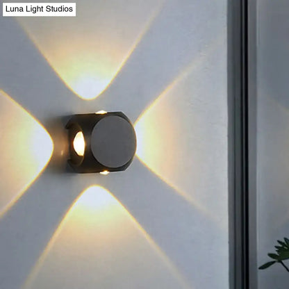 Mini Cube Wall Sconce by Decorbites in matte black metal with warm light on Tampa Home & Garden Store