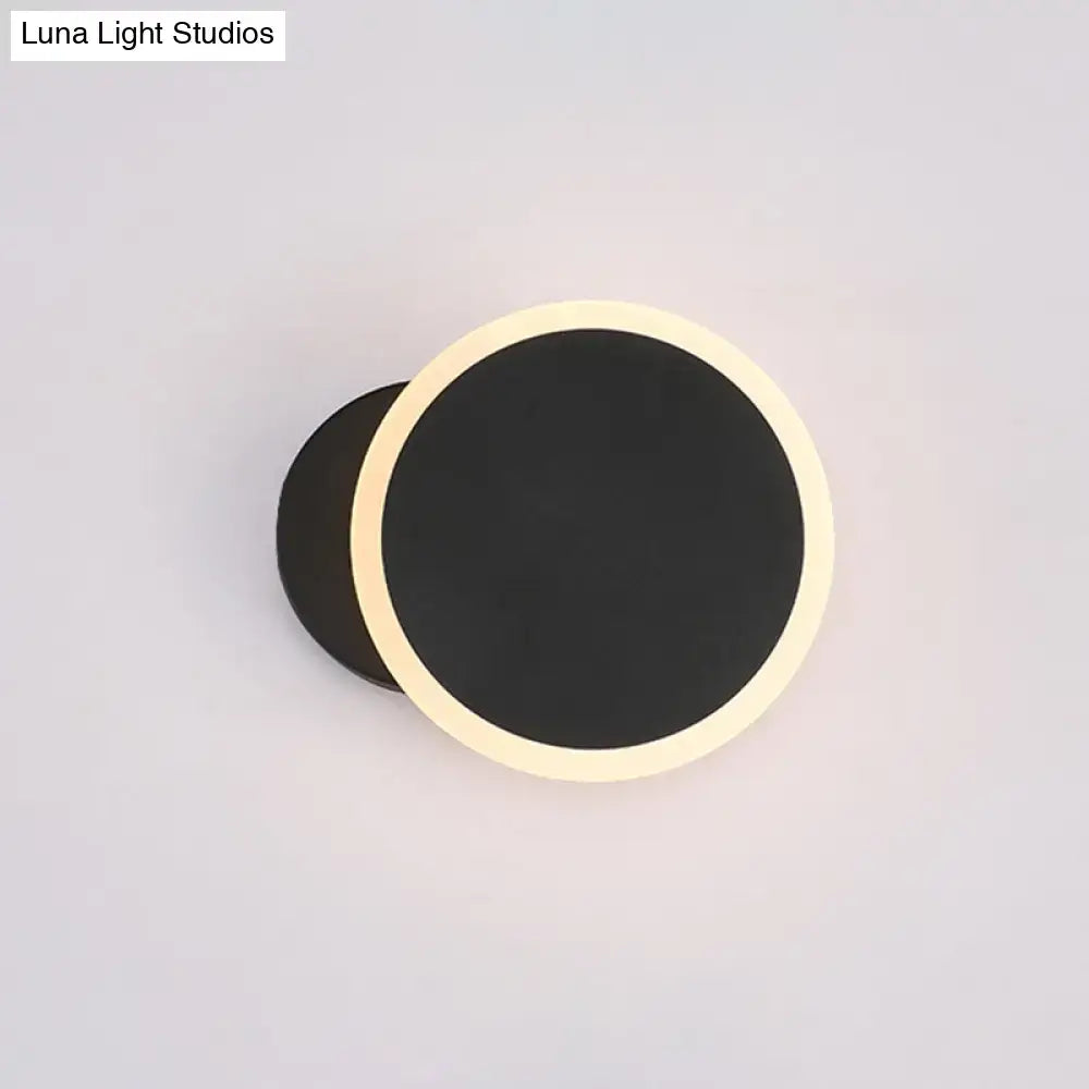 Decorbites black round LED wall sconce with warm white halo on Tampa Home & Garden Store