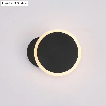 Decorbites black round LED wall sconce with warm white halo on Tampa Home & Garden Store