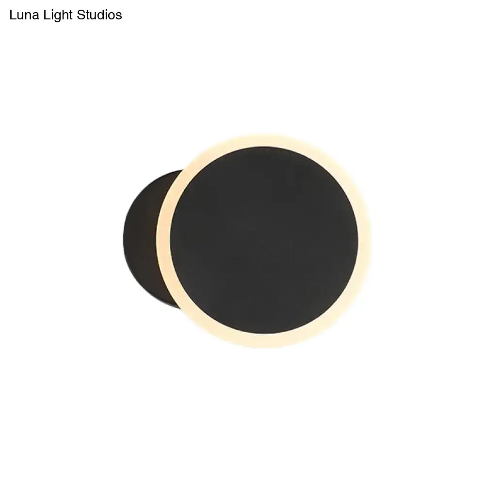 Black White LED Sconce Decorbites round black disk with warm halo glow on Tampa Home & Garden Store