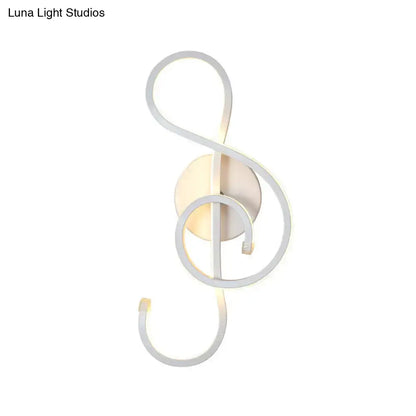 White musical note wall lamp with looping metal frame and warm LED glow Decorbites on Tampa Home & Garden Store