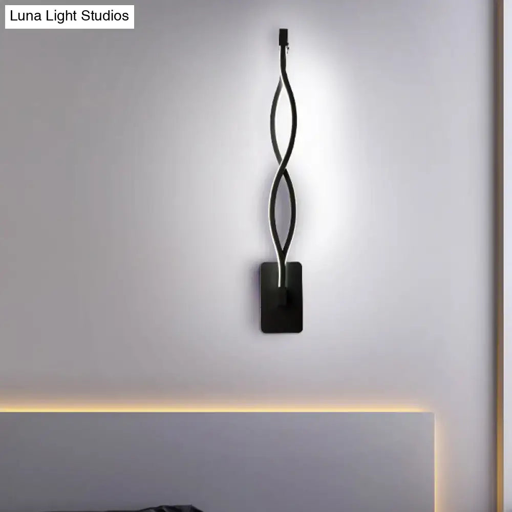 White musical note wall lamp with intertwined curved arms on black square mount, warm glow on Tampa Home & Garden Store