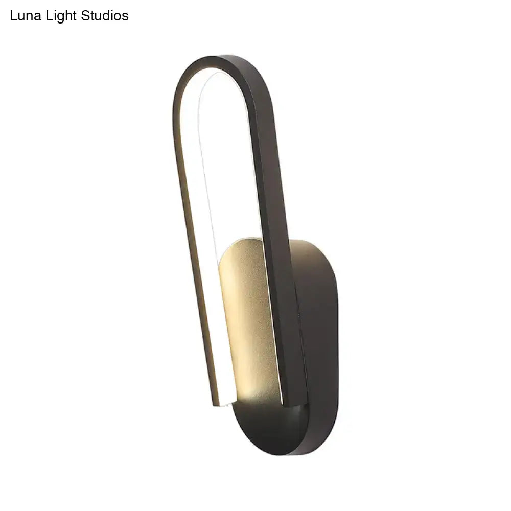 Black metal acrylic parlor wall sconce by Decorbites with curved loop design on Tampa Home & Garden Store