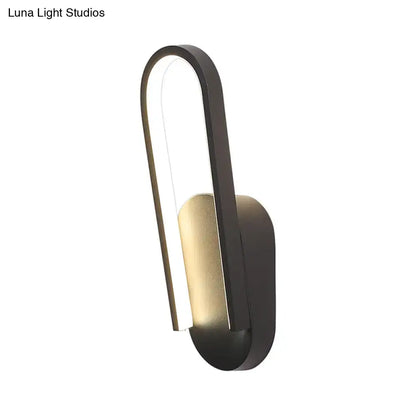 Black metal acrylic parlor wall sconce by Decorbites with curved loop design on Tampa Home & Garden Store