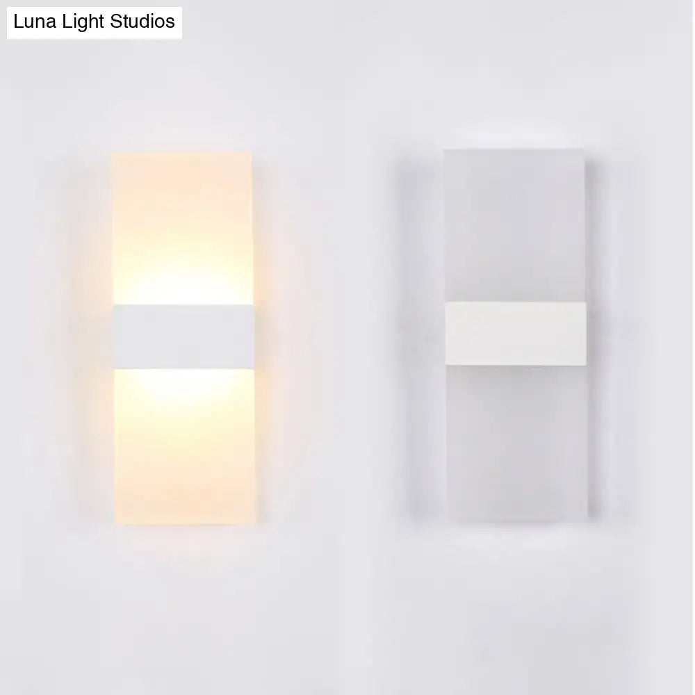 Decorbites black-white rectangular sconce pair; lit warm left, unlit right, modern wall lights on Tampa Home & Garden Store