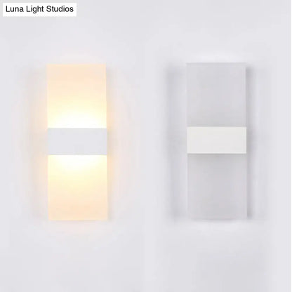 Decorbites black-white rectangular sconce pair; lit warm left, unlit right, modern wall lights on Tampa Home & Garden Store