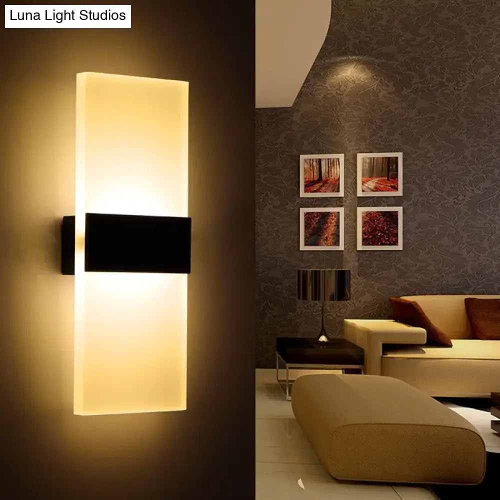 Black White Rectangular Sconce by Decorbites wall-mounted with warm glow in a modern living room on Tampa Home & Garden Store