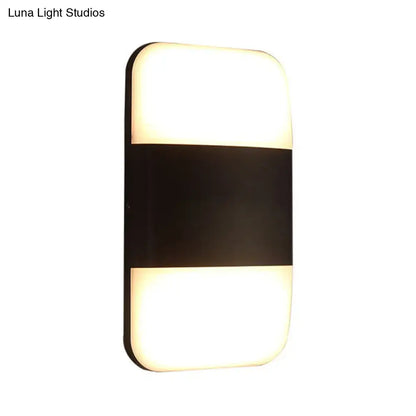 Decorbites black rectangle cast iron wall sconce with frosted glass top and bottom panels on Tampa Home & Garden Store