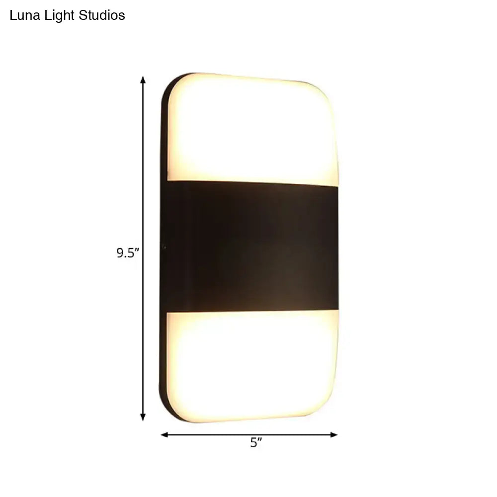 Black rectangle cast iron wall sconce by Decorbites, 9.5x5, rounded corners, dual glow panels on Tampa Home & Garden Store