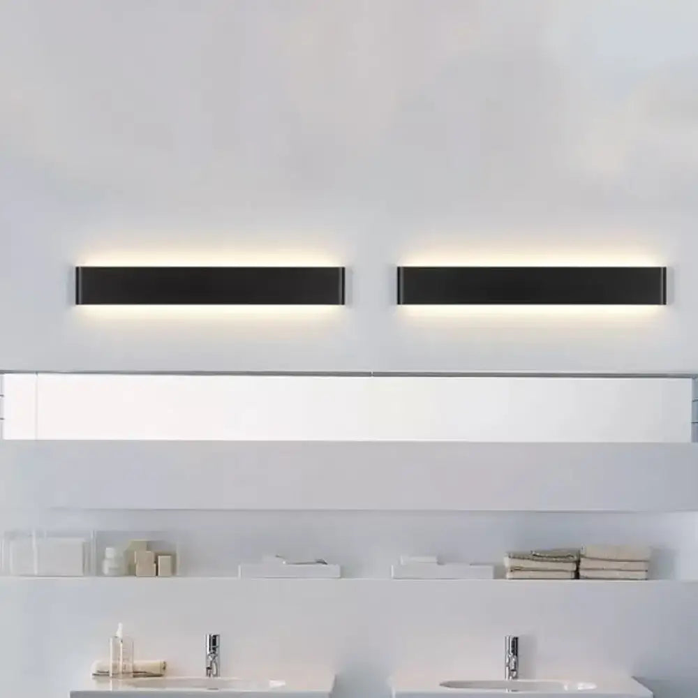 Black rectangular wall lamp pair with a subtle backlit glow for a modern bathroom on Tampa Home & Garden Store