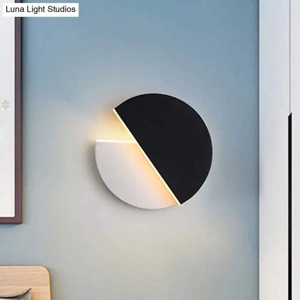 Black acrylic minimalist LED wall lamp by Decorbites, two-tone disc with diagonal glow on Tampa Home & Garden Store