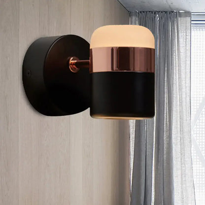 Black glass rotatable LED wall sconce with copper band and backplate on Tampa Home & Garden Store