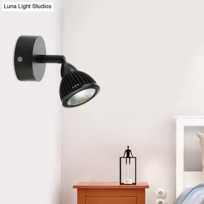 Black LED wall spotlight with round metal wall mount and adjustable arm for accent lighting on Tampa Home & Garden Store