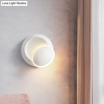 White Eclipse Wall Lamp Decorbites; wall sconce with overlapping discs casting warm light on Tampa Home & Garden Store