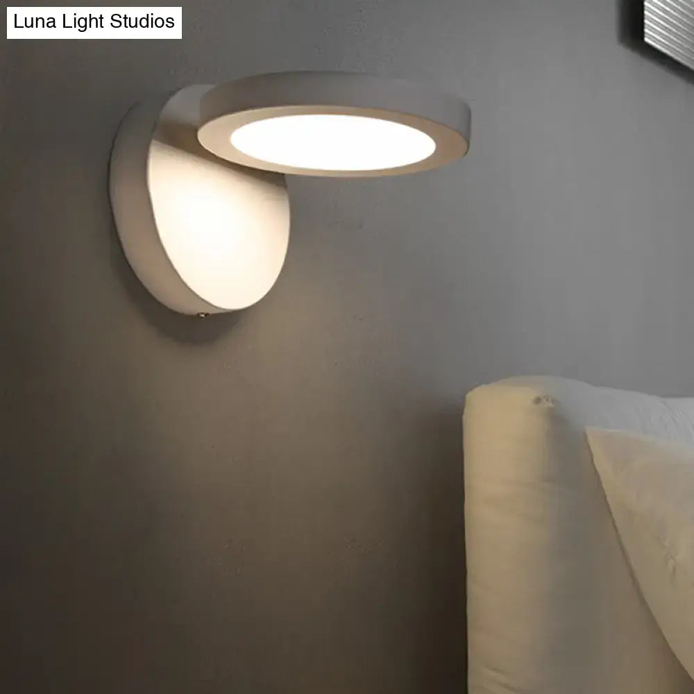 Acrylic rotating wall light in white with circular disc shade and wall-mount base on Tampa Home & Garden Store
