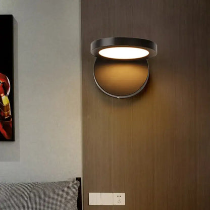 Acrylic rotating wall light by Decorbites mounted on wood wall, black frame with amber glow on Tampa Home & Garden Store