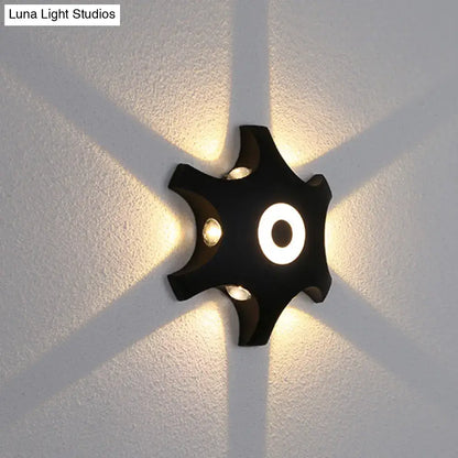 Decorbites Star LED Wall Light black star shape with central glowing ring, wall-mounted on Tampa Home & Garden Store
