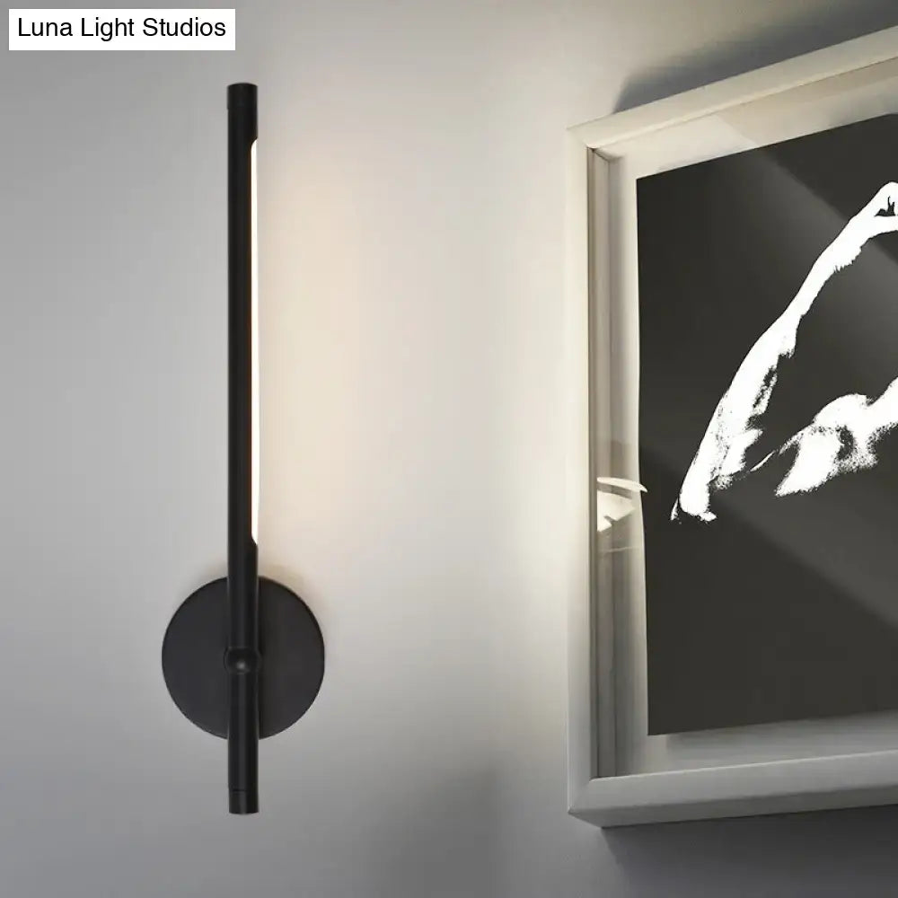 Metal Tubular Wall Sconce Direct-Wired; black metal tube, vertical LED light, wall-mounted on Tampa Home & Garden Store